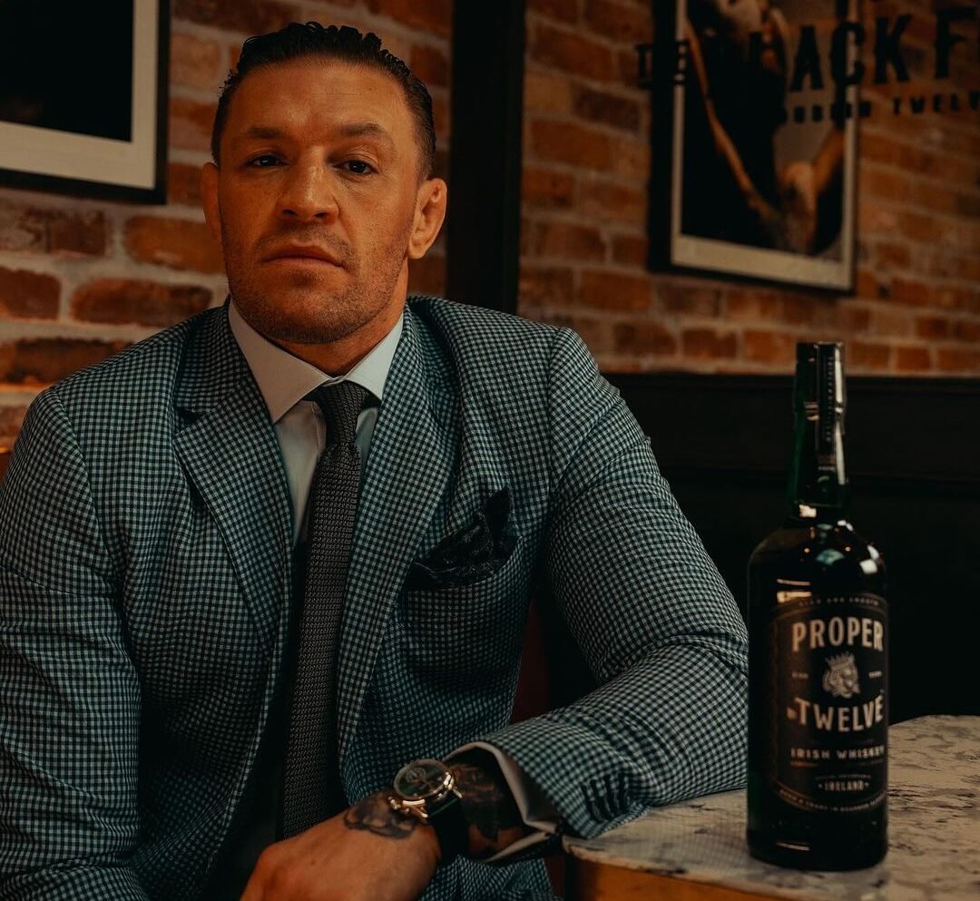 Conor McGregor with a bottle of Proper No. Twelve Irish Whiskey