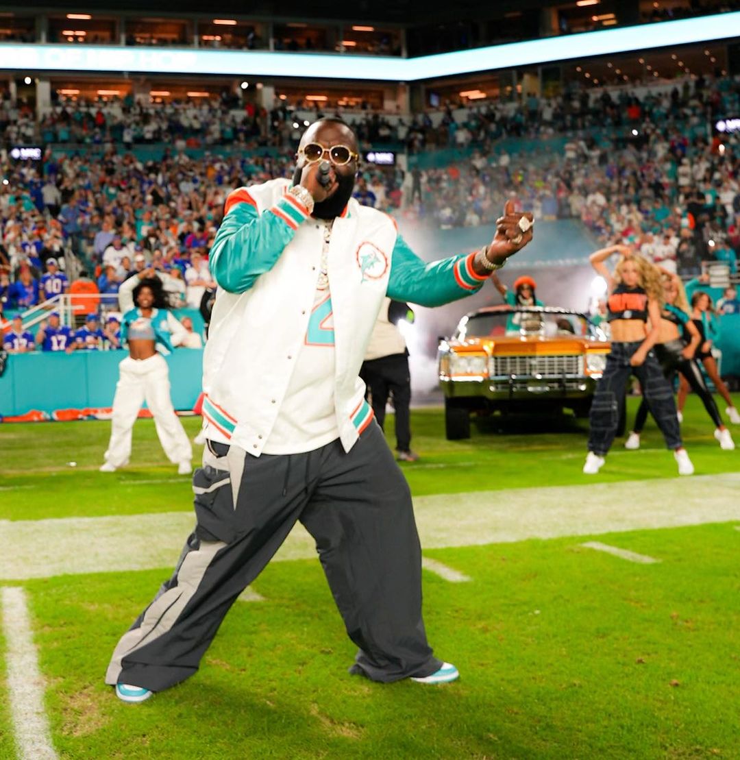 Rick Ross performing at a sporting event